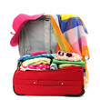 Red travel suitcase with personal belongings isolated on white