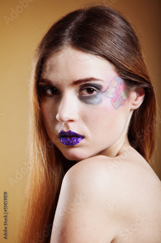 Photo: portrait of young beautiful woman creative make up portrait of young beautiful woman creative make up