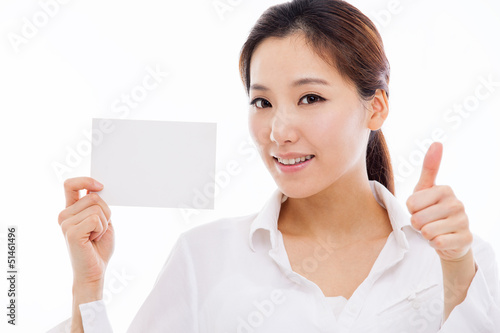 Photo: Asian woman showing empty card Asian woman showing empty card