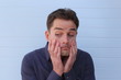 Worried doubtful face of an attractive man