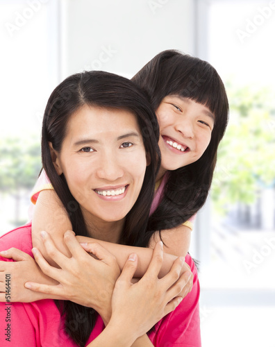 Photo: happy asian little girl with her mother happy asian little girl with her mother