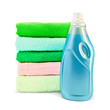 Fabric softener the bottle and a stack of towels