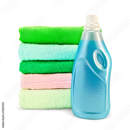 Photo: Fabric softener the bottle and a stack of towels Fabric softener the bottle and a stack of towels