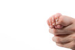 small baby holding her father finger