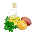 Potatoes red and yellow  with a bottle of oil