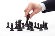 Photo: Business man moving chess figure Business man moving chess figure