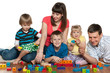 Happy family are playing on the floor