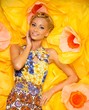 Photo: Beautiful young blond woman in colourful dress Beautiful young blond woman in colourful dress