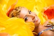 Beautiful young blond woman in colourful dress 