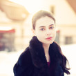 portrait of a beautiful brunette on a city street