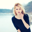 beautiful blonde near the river in the cold