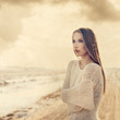 beautiful girl on the road. vintage photo in golden tones
