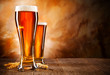Photo: Glasses of beer on wooden table Glasses of beer on wooden table