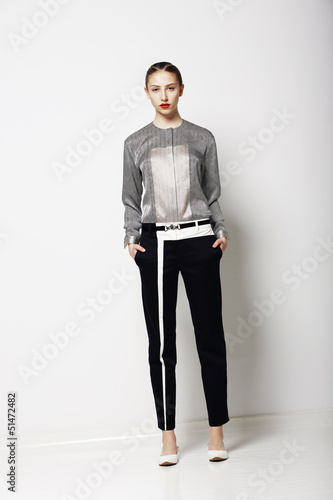 Photo: Fashion Model in Modern Costume. Spring Time Collection. Trend Fashion Model in Modern Costume. Spring Time Collection. Trend