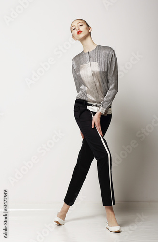 Photo: Sporty Slim Woman in Black Pants - Summer Collection. Glamor Sporty Slim Woman in Black Pants - Summer Collection. Glamor