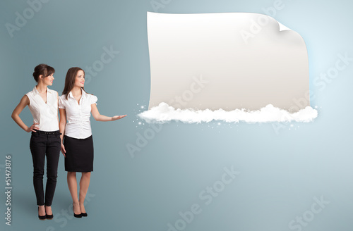 Photo: pretty women presenting modern copy space on clouds pretty women presenting modern copy space on clouds