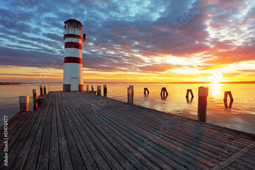 Fototapeta Lighthouse at Lake Neusiedl at sunset