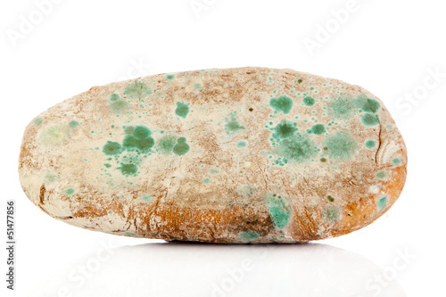 Photo: Mold on bread. Mouldy bread, isolated on a white background Mold on bread. Mouldy bread, isolated on a white background