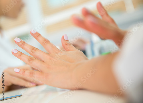 Photo: Woman getting her nails done Woman getting her nails done