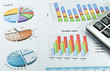 Document with Business graph and iphone mobile