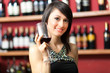 Woman tasting red wine