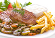 Pork chop with French fries and vegetables