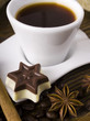 Photo: coffee , sweets and spices on an old wooden table coffee , sweets and spices on an old wooden table