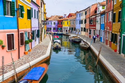Photo: Burano canal full of boats and colorful houses Burano canal full of boats and colorful houses