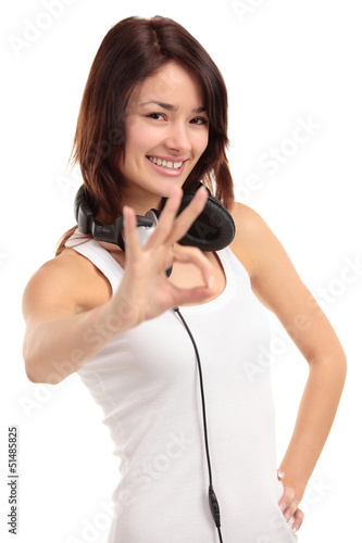 Photo: Portrait of a pretty young woman showing the okay sign Portrait of a pretty young woman showing the okay sign
