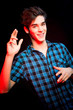 Young man dancing and enjoying music at disco
