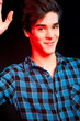 Young man dancing and enjoying music at disco