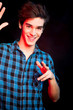 Young man dancing and enjoying music at disco