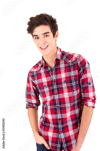 Photo: Young casual man posing isolated over white Young casual man posing isolated over white