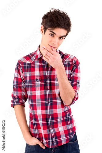 Photo: Young casual man posing isolated over white Young casual man posing isolated over white