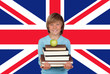 Happy Boy Holding Stack Of Books With Apple