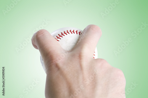 Photo: split finger baseball grip on green with clipping path split finger baseball grip on green with clipping path