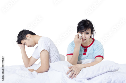 Photo: Sad couple after fighting in bed Sad couple after fighting in bed
