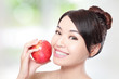 young woman eating red apple with health teeth