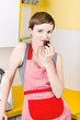 Woman in Apron Eating Cake