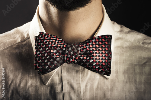 Photo: Man wearing an elegant bow tie Man wearing an elegant bow tie