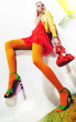 Beauty - lovely young female blonde fashion model sitting