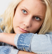 Young and natural blond woman with a soft smile