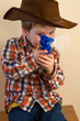 Boy firing cap gun