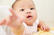 Baby reaching to camera