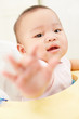 Baby reaching to camera