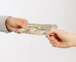 Hand giving money, isolated on white background