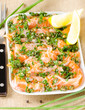 Salmon carpaccio - fresh salmon slices in marinade on burlapsack