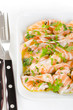 Salmon carpaccio - fresh salmon slices in marinade