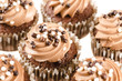 Chocolate cupcakes with chocolate icing and decoration isolated