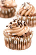 Photo: Chocolate cupcakes with chocolate icing and decoration isolated Chocolate cupcakes with chocolate icing and decoration isolated